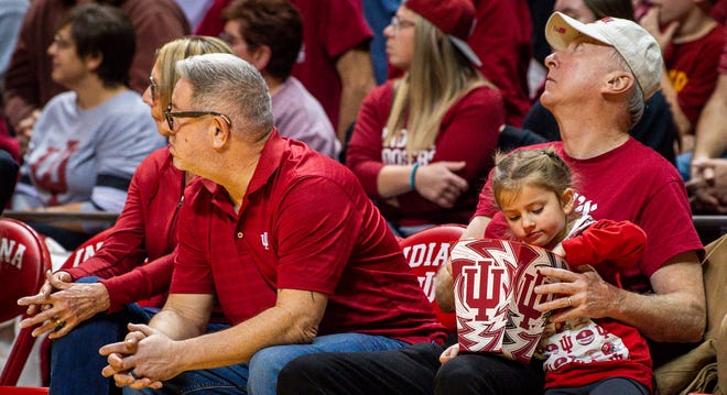 A young fan eats popcorn during the first half of the Indiana versus Bowling Green women's basketball game at Simon Skjodt Assembly Hall on Friday, December 22, 2023.