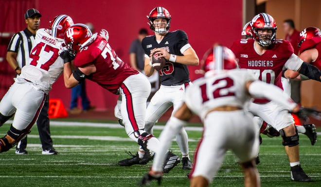 Indiana's Tyler Cherry (15) looks downfeild during the Indiana football spring game at Memorial Stadaium on Thursday, April 18, 2024.