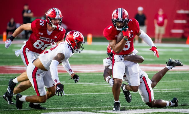 Indiana's Omar Cooper Jr. (3) runs after the catch during the Indiana football spring game at Memorial Stadaium on Thursday, April 18, 2024.