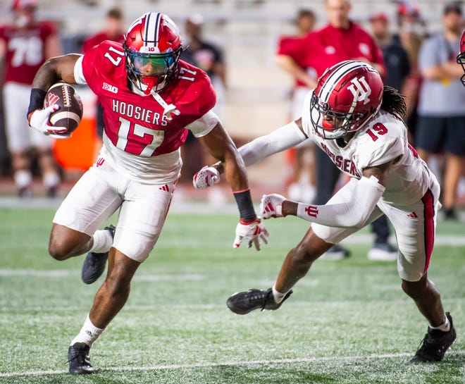 Indiana's Ty Son Lawton (17) avoids Indiana's Josh Sanguinetti (19) during the Indiana football spring game at Memorial Stadaium on Thursday, April 18, 2024.