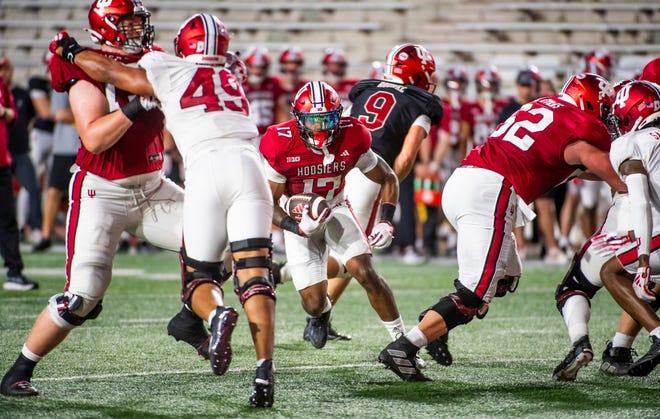 Indiana's Ty Son Lawton (17) runs during the Indiana football spring game at Memorial Stadaium on Thursday, April 18, 2024.