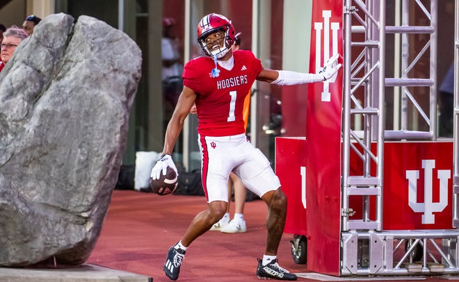 Indiana's Donaven McCulley (1) smiles after scoring a touchdown during the Indiana football spring game at Memorial Stadaium on Thursday, April 18, 2024.