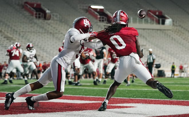 Indiana Hoosiers wide receiver Andison Coby (0) catches a pass for a touchdown against Indiana Hoosiers defensive back Jamier Johnson (9) during the Indiana football spring game at Memorial Stadium on Thursday, April 18, 2024.