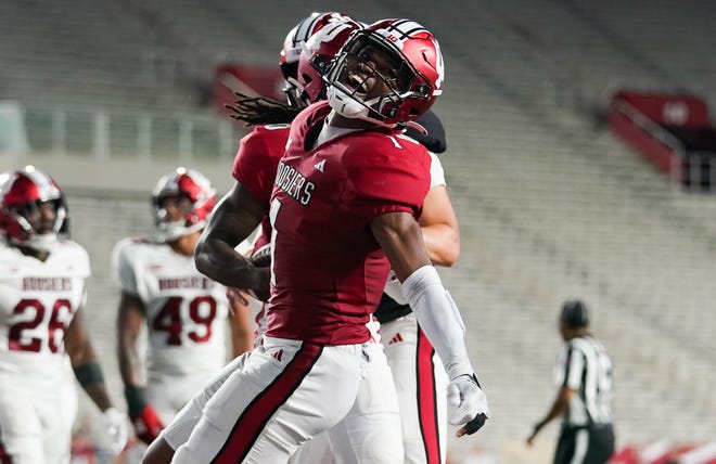 Indiana Hoosiers wide receiver Donaven McCulley (1) celebrates after a touchdown by Indiana Hoosiers wide receiver Andison Coby (0) during the Indiana football spring game at Memorial Stadium on Thursday, April 18, 2024.