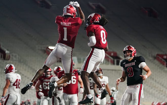 Indiana Hoosiers wide receiver Donaven McCulley (1) celebrates with Indiana Hoosiers wide receiver Andison Coby (0) after a touchdown during the Indiana football spring game at Memorial Stadium on Thursday, April 18, 2024.