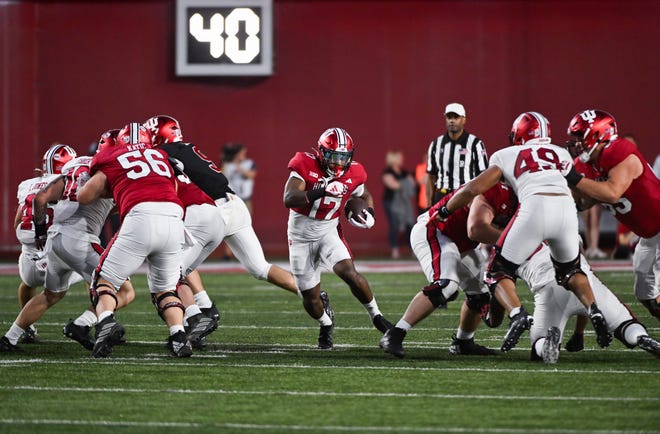 Indiana Hoosiers running back Ty Son Lawton (17) runs the ball during the Indiana football spring game at Memorial Stadium on Thursday, April 18, 2024.