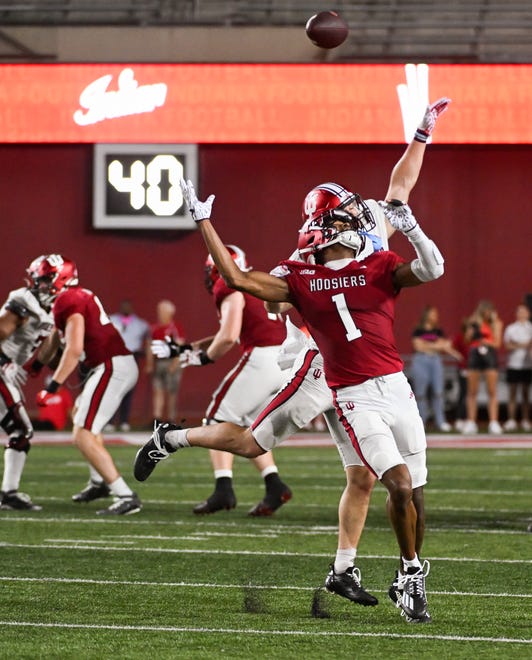 Indiana Hoosiers linebacker Isaiah Jones (46) is called for a pass interference penalty against Indiana Hoosiers wide receiver Donaven McCulley (1) during the Indiana football spring game at Memorial Stadium on Thursday, April 18, 2024.