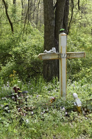 This roadside memorial on Texas Pike in Owen County marks the place where the body of Elizabeth "Bizzy" Stevens was found Sept. 14, 2021.