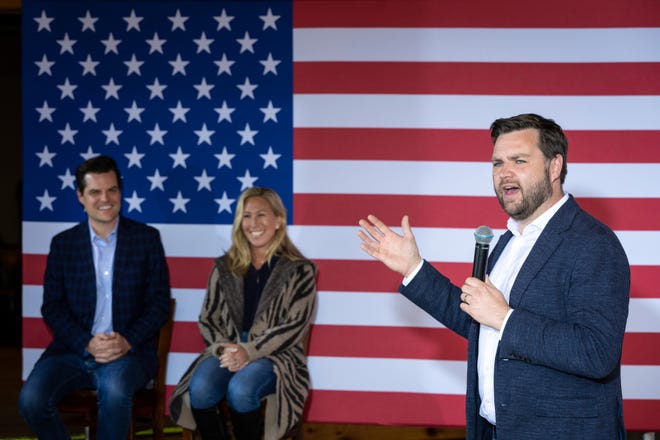 (L-R) Rep. Matt Gaetz (R-FL) and Rep. Marjorie Taylor Greene (R-GA) look on as J.D. Vance, a Republican candidate for U.S. Senate in Ohio, speaks during a campaign rally at The Trout Club on April 30, 2022 in Newark, Ohio.