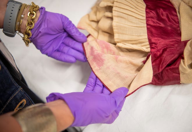 Dye has transferred over time on this 1879 graduation dress worn by Indiana University alumna Ida Kenney.