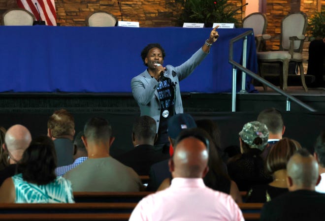 Rev. Lorenzo Sewell of 180 Church in Detroit talks to the crowd before a roundtable discussion with former President Donald Trump inside his church in Detroit on Saturday, June 15, 2024.