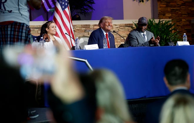 Former President Donald Trump laughs during a roundtable discussion inside the 180 Church in Detroit on Saturday, June 15, 2024.