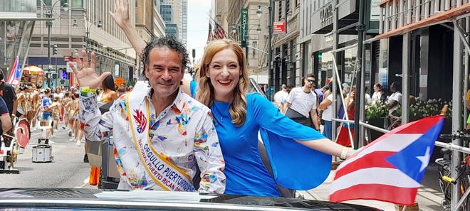 Indiana University cello professor Emilio Colon and his wife, Cara Elise Colon enjoy the National Puerto Rican Parade in Manhattan. He was the first classical music instrumentalist to be honored at the parade.