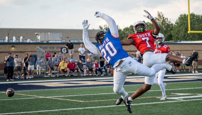 Indiana All-Star North Dontell Harris (20), left, and Indiana All-Star South Stephon Opoku (7) miss a catch during the Indiana Football Coaches All-Star game, Friday, July 12, 2024, at Decatur Central High School in Indianapolis.