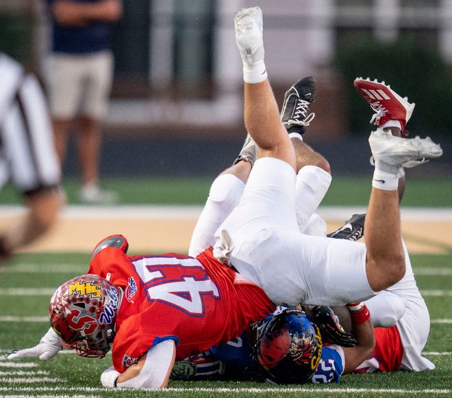 Indiana All-Star South Wyatt Woodall (47) tackles Indiana All-Star North Uriah Buchanan (22) during the Indiana Football Coaches All-Star game, Friday, July 12, 2024, at Decatur Central High School in Indianapolis.