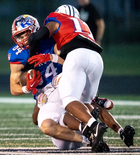 Indiana All-Star South Alvin Contreras (17) tackles Indiana All-Star North Deakon Dilts (84) during the Indiana Football Coaches All-Star game, Friday, July 12, 2024, at Decatur Central High School in Indianapolis.