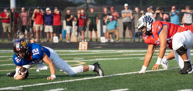 Indiana All-Star North Owen Roeder (12) dives to catch the ball during the Indiana Football Coaches All-Star game, Friday, July 12, 2024, at Decatur Central High School in Indianapolis.