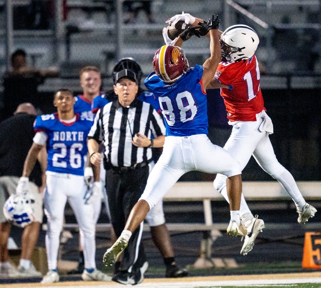 Indiana All-Star North Gabe McGuire (88), left, and Indiana All-Star South Brian Wall (19) jump to catch the ball during the Indiana Football Coaches All-Star game, Friday, July 12, 2024, at Decatur Central High School in Indianapolis.