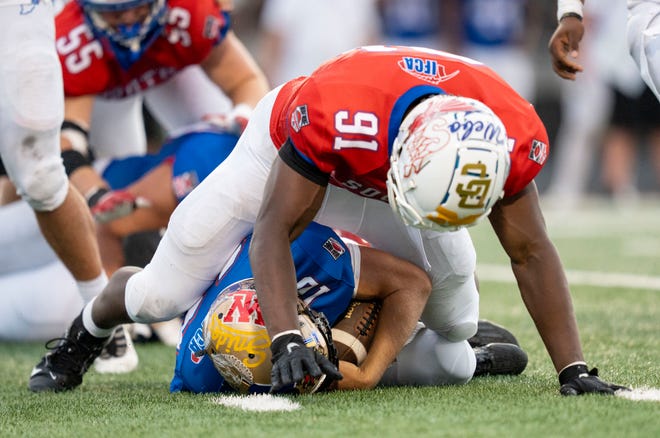 Indiana All-Star South Elijah Shankle (91) tackles Indiana All-Star North Nolan McCullough (10) during the Indiana Football Coaches All-Star game, Friday, July 12, 2024, at Decatur Central High School in Indianapolis.