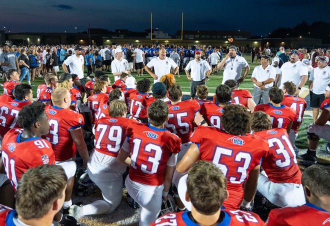 Indiana All-Star South head coach Jake Gilbert, center, gives a post game speech to his players after the Indiana Football Coaches All-Star game, Friday, July 12, 2024, at Decatur Central High School in Indianapolis.