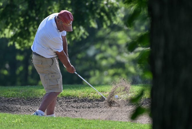 Roger Rainbolt hits out of a bunker during the semi-finals in the Super Senior Championship division in the City Golf Tournament at Cascades Golf Course on Saturday, July 13, 2024.