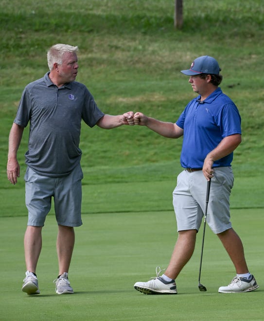 Caddie Lance Ringler congratulates Jason Bannister after winning a hole during the semi-finals in the Men’s Championship division of the City Golf Tournament at Cascades Golf Course on Saturday, July 13, 2024.