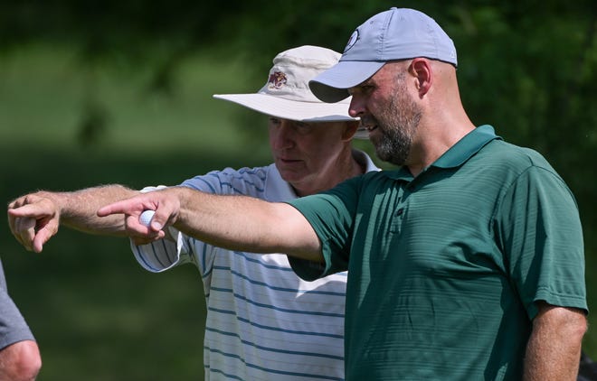 Caddie Bob Hasty (left) talks putting strategy with Chris Williams during the semi-finals in the Men’s Championship division of the City Golf Tournament at Cascades Golf Course on Saturday, July 13, 2024.