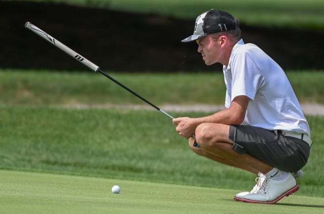 Logan Vernon lines up a putt during the semi-finals in the Men's Championship division in the City Golf Tournament at Cascades Golf Course on Saturday, July 13, 2024.