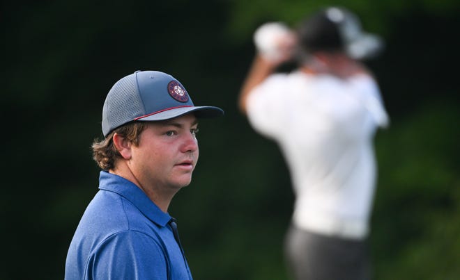 Jason Bannister watches as Logan Vernon hits a tee shot during the semi-finals in the Men's Championship division in the City Golf Tournament at Cascades Golf Course on Saturday, July 13, 2024.