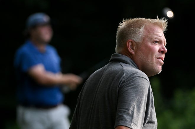 Caddie Lance Ringler watches a tee shot from Jason Bannister during the semi-finals in the Men’s Championship division of the City Golf Tournament at Cascades Golf Course on Saturday, July 13, 2024.