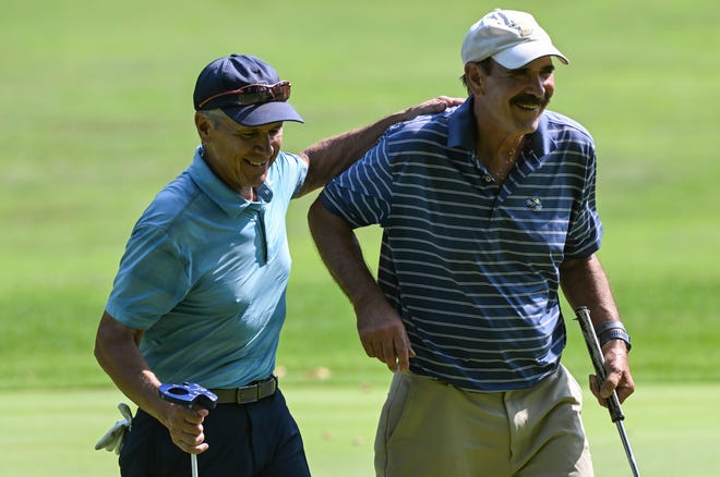 Dan Neubecker and Rory Brown walk off the 18th green after Neubecker won their match 1 up during the finals in the Super Senior Championship division of the City Golf Tournament at Cascades Golf Course on Sunday, July 14, 2024.