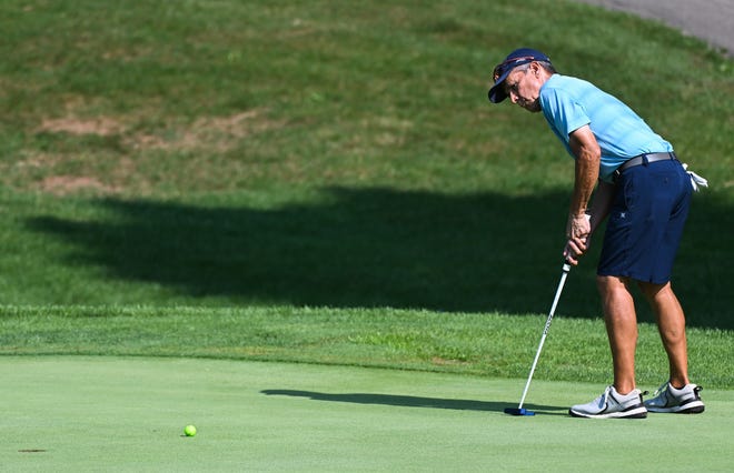 Dan Neubecker hits a putt during the finals in the Super Senior Championship division of the City Golf Tournament at Cascades Golf Course on Sunday, July 14, 2024.