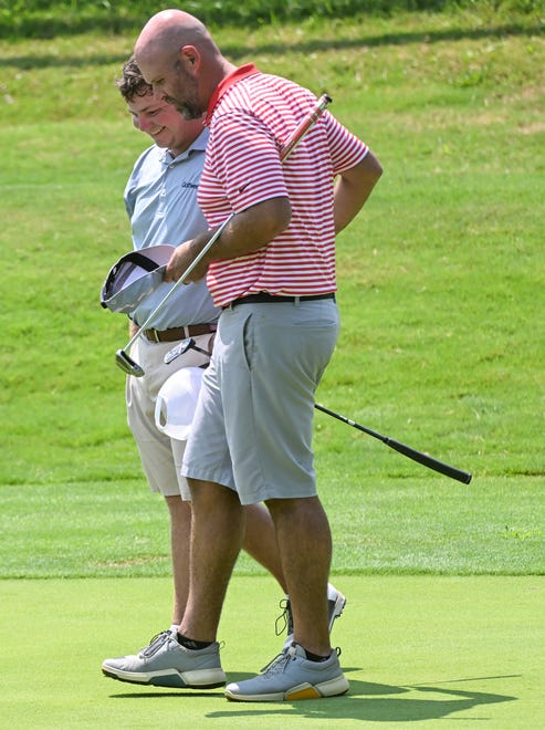 Jason Bannister and Chris Williams congratulate each other after Bannister’s 8 and 6 win in the finals of the Men’s Championship division of the City Golf Tournament at Cascades Golf Course on Sunday, July 14, 2024.