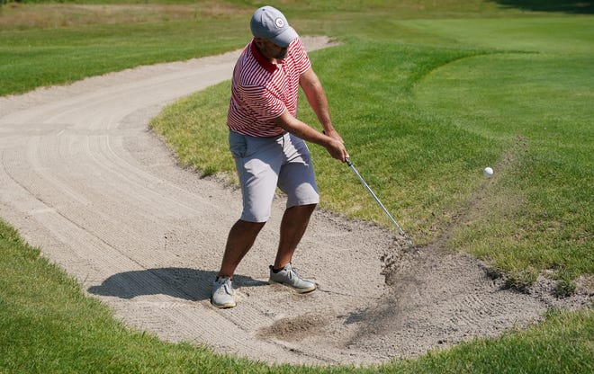 Chris Williams hits out of a bunker during the finals in the Men’s Championship division of the City Golf Tournament at Cascades Golf Course on Sunday, July 14, 2024.