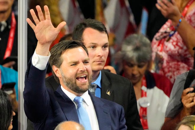 Sen. J.D. Vance (Ohio) waves to the crowd after being introduced as the vice-presidential running mate for Donald Trump during the first day of the Republican National Convention. The RNC kicked off the first day of the convention with the roll call vote of the states.