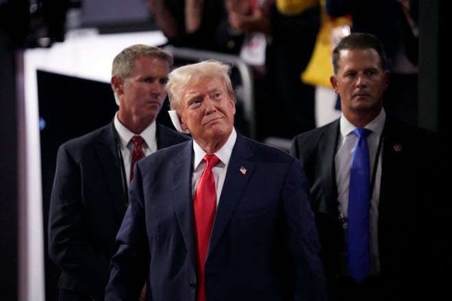 Republican presidential nominee Donald J. Trump leaves the convention floor at the end of the first day of the Republican National Convention on July 15, 2024, in Milwaukee, Wis. The RNC kicked off the first day of the convention with the roll call vote of the states.