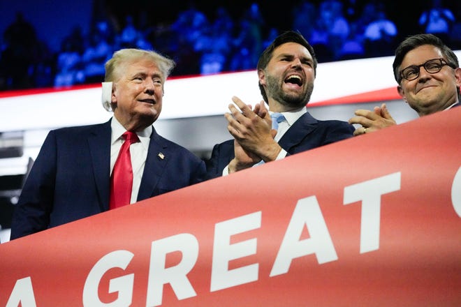 Former President Donald Trump appears with Republican vice president nominee JD Vance and Speaker of the House Mike Johnson during the first day of the Republican National Convention. The RNC kicked off the first day of the convention with the roll call vote of the states on July 15, 2024, in Milwaukee, Wis.