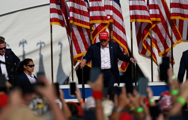 Republican presidential candidate, former U.S. President Donald Trump, arrives for a rally at Butler Farm Show Inc. on July 13, 2024, in Butler, Pennsylvania. Shortly after, shots rang out, and Trump slumped before being whisked away by Secret Service with injuries visible to the side of his head. Butler County District Attorney Richard Goldinger said the shooter and one audience member are dead, and another was injured.