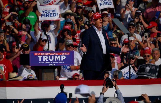 Republican presidential candidate, former U.S. President Donald Trump, speaks at a rally at Butler Farm Show Inc. on July 13, 2024, in Butler, Pennsylvania. Shortly after, shots rang out, and Trump slumped before being whisked away by the Secret Service with injuries visible to the side of his head. Butler County District Attorney Richard Goldinger said the shooter and one audience member are dead, and another was injured.