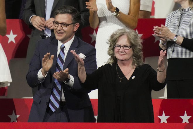 Beverly Vance is recognized during a speech by her son, Republican vice presidential nominee Sen. J.D. Vance, R-Ohio, during the third day of the Republican National Convention at Fiserv Forum. At left is Speaker of the House Mike Johnson. The third day of the RNC focused on foreign policy and threats.