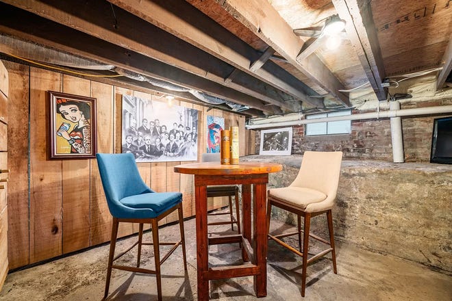 This Indianapolis home for sale has it's own hidden speakeasy, 3 bedrooms, 3 bathrooms and a 4-car garage.