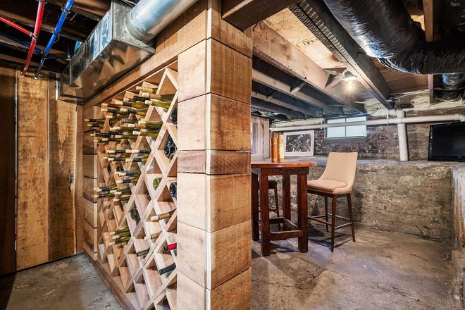 This Indianapolis home for sale has it's own hidden speakeasy, 3 bedrooms, 3 bathrooms and a 4-car garage.