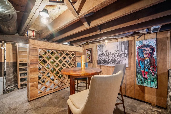 This Indianapolis home for sale has it's own hidden speakeasy, 3 bedrooms, 3 bathrooms and a 4-car garage.