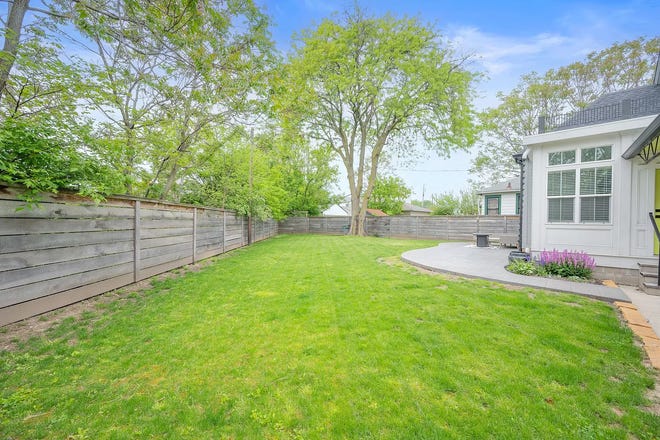 This Indianapolis home for sale has it's own hidden speakeasy, 3 bedrooms, 3 bathrooms and a 4-car garage.