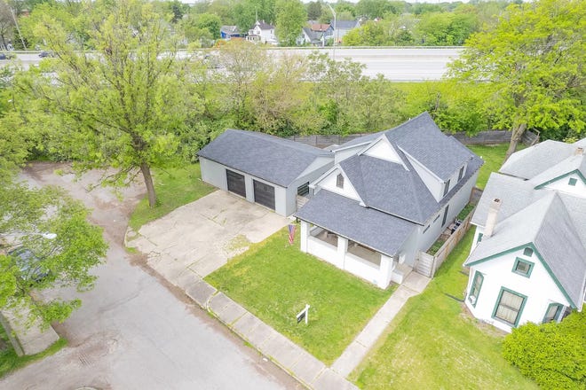 This Indianapolis home for sale has it's own hidden speakeasy, 3 bedrooms, 3 bathrooms and a 4-car garage.