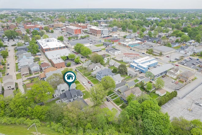 This Indianapolis home for sale has it's own hidden speakeasy, 3 bedrooms, 3 bathrooms and a 4-car garage.