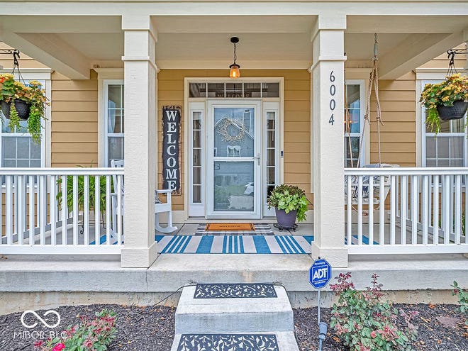 This home in Avon has tons of space inside and a backyard oasis outside with a swim spa and wooded backdrop.