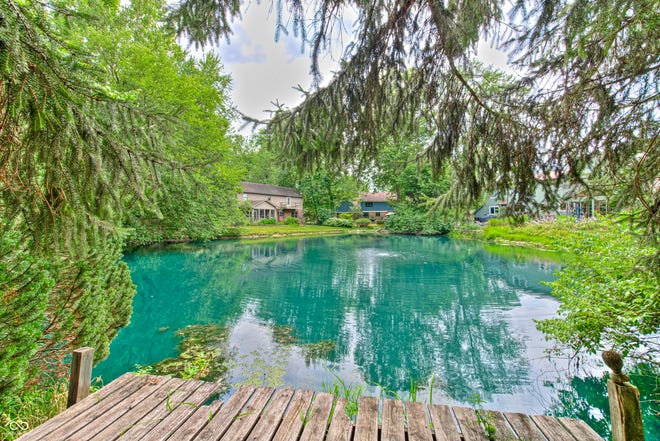 This Eagle Creek home has more than 4,00 sq ft of space and a park-like backyard overlooking a serene pond.