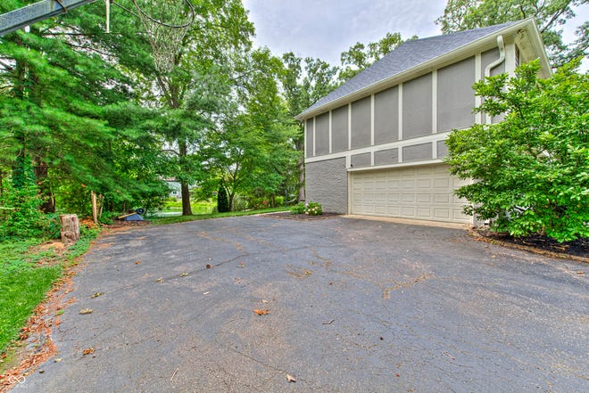 This Eagle Creek home has more than 4,00 sq ft of space and a park-like backyard overlooking a serene pond.