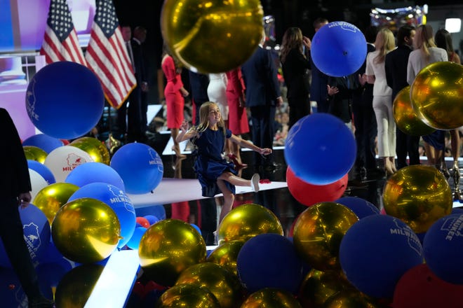 Donald Trump and his family along with JD Vance and his wife Usha Chilukuri Vance stand on stage as balloons drop at the the final day of the Republican National Convention at the Fiserv Forum. The final day of the RNC featured a keynote address by Republican presidential nominee Donald Trump.